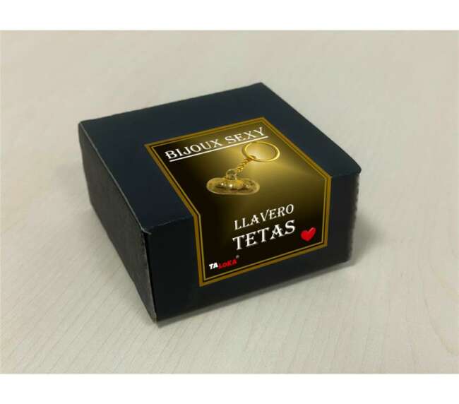 Golden keychain in the shape of breast